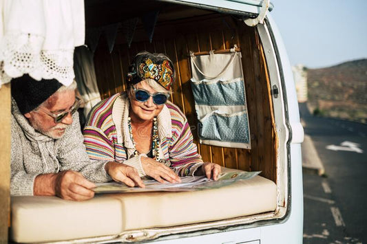 OLDER COUPLE IN CAMPERVAN GRAY NOMAD