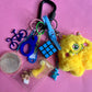 Bag charm yellow alien