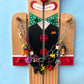 Goodordering Clown wood prop with bag charm chain displayed on it 