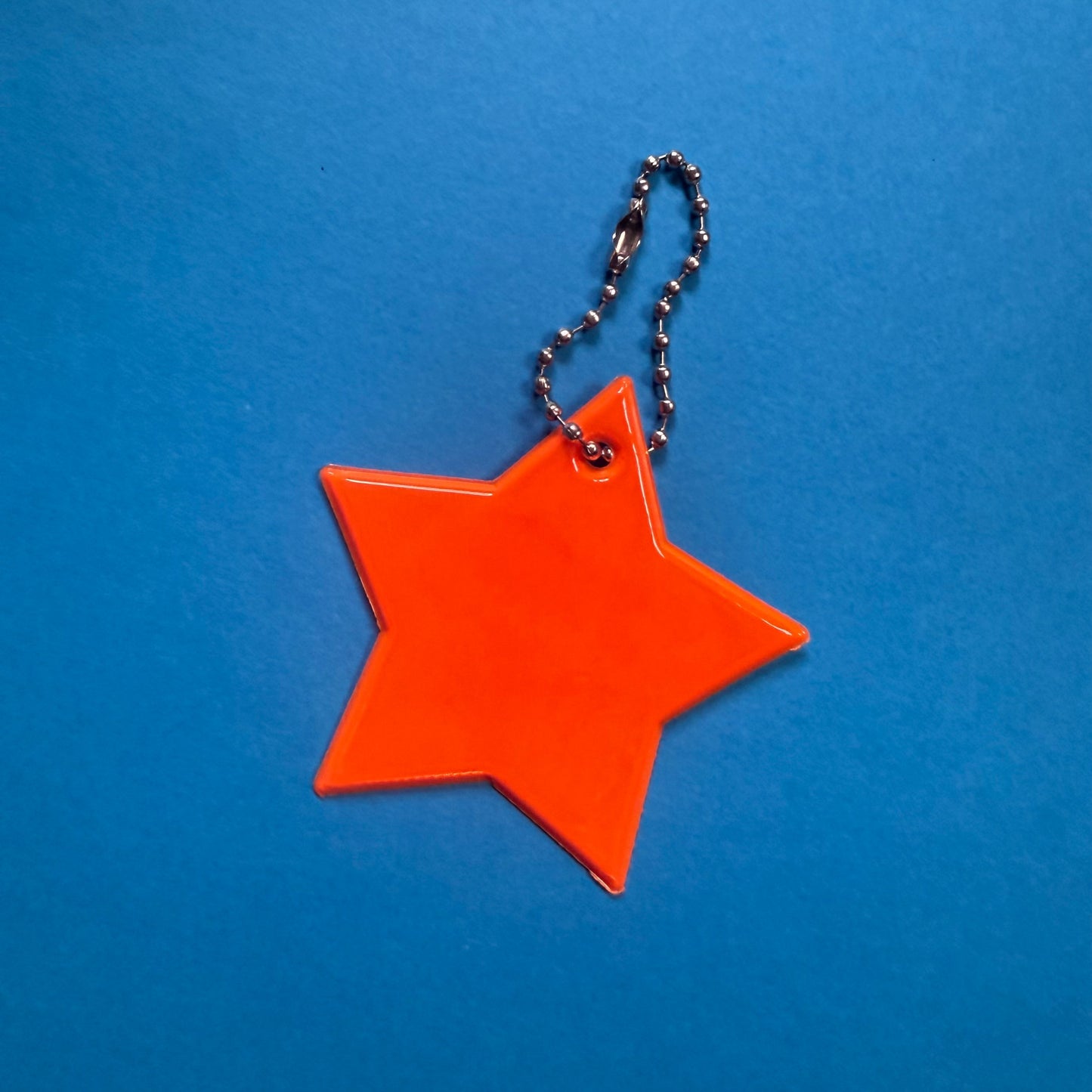 Neon star light reflective charm