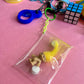 Bag charm yellow alien