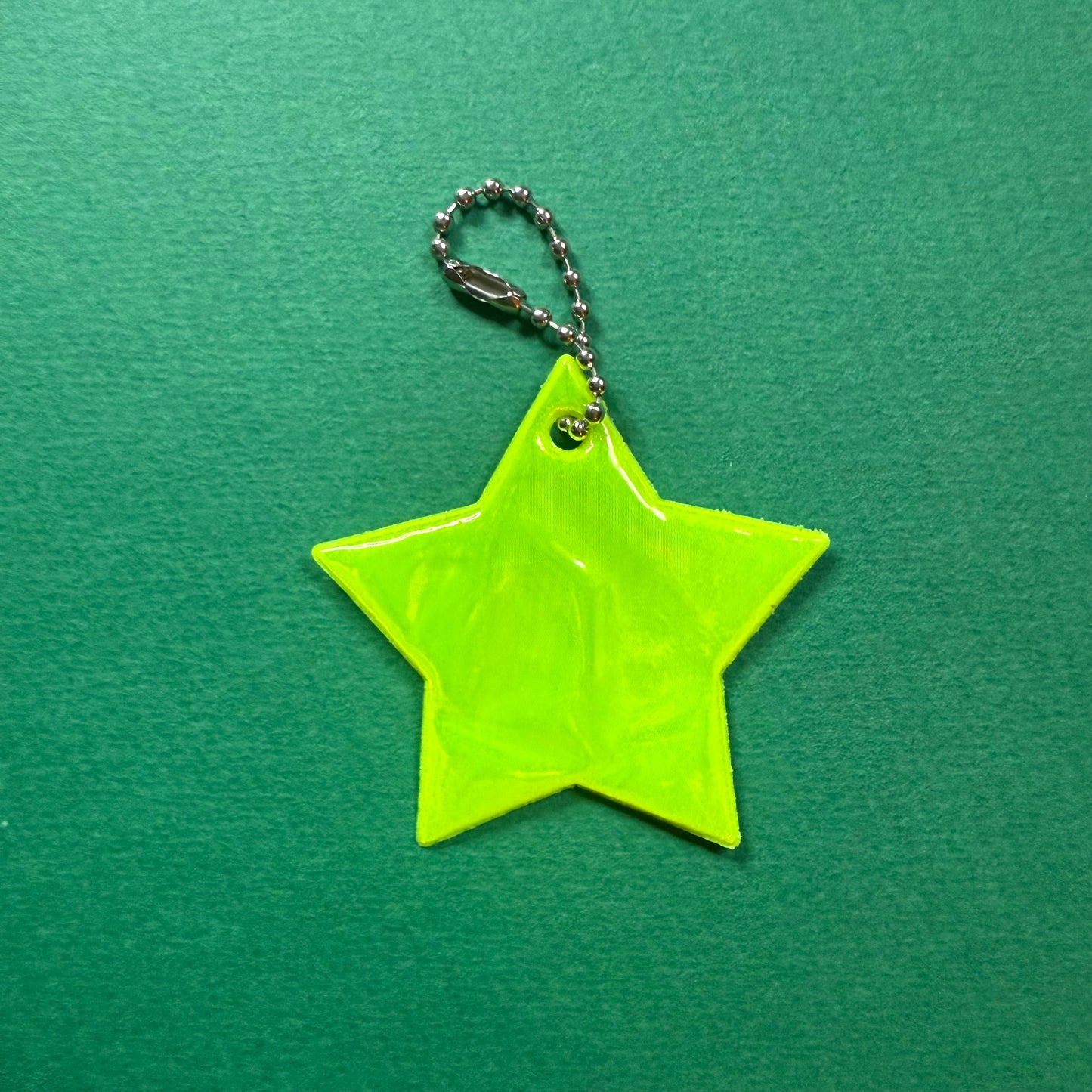 Neon star light reflective charm